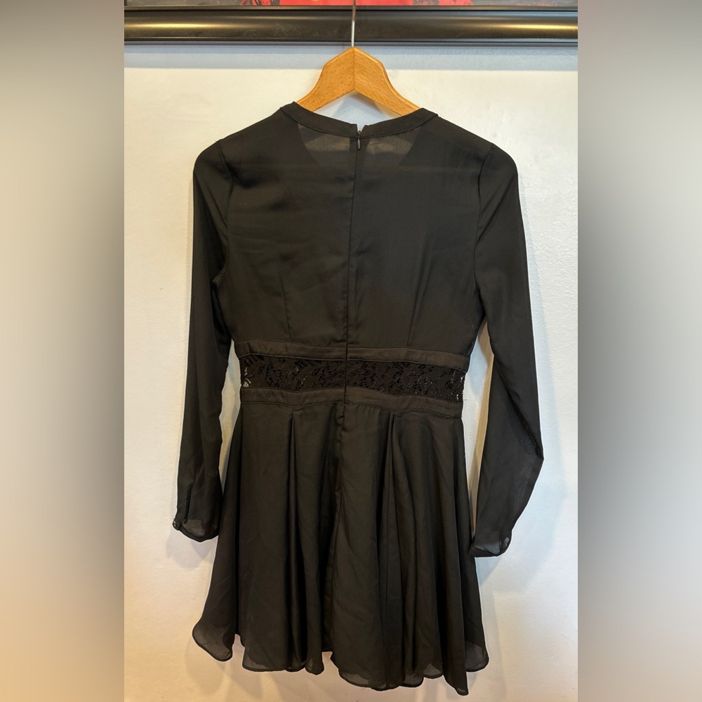 Semi-sheer black dress with a-line flare and lace trim. - Picture 2 of 2